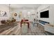 Open-concept living and dining area with stylish furnishings, modern lighting, and a fireplace at 3165 Dogwood Dr # 107, Hapeville, GA 30354