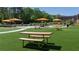Serene community park with picnic tables, green space, playground, and colorful umbrellas for enjoying the outdoors at 3165 Dogwood Dr # 107, Hapeville, GA 30354