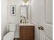 Stylish powder room featuring a modern vanity, sleek mirror, and contemporary fixtures at 3165 Dogwood Dr # 107, Hapeville, GA 30354
