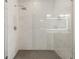 Contemporary shower with glass enclosure and rainfall shower head, plus marble-look walls at 3165 Dogwood Dr # 107, Hapeville, GA 30354