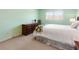 Brightly lit bedroom featuring a large window and traditional decor with ample closet space at 6784 Tilton Ln, Peachtree Corners, GA 30360