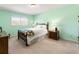 Bright bedroom with a large window letting in natural light and neutral decor at 6784 Tilton Ln, Peachtree Corners, GA 30360