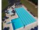 Aerial view of a community pool with multiple seating areas and a diving board at 6784 Tilton Ln, Peachtree Corners, GA 30360