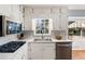 Updated kitchen featuring modern appliances, white cabinetry, and natural light at 6784 Tilton Ln, Peachtree Corners, GA 30360