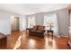 Inviting living room featuring hardwood floors and ample natural light at 6784 Tilton Ln, Peachtree Corners, GA 30360