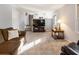 Comfortable living room with plush carpet, stairs and open view to kitchen at 6784 Tilton Ln, Peachtree Corners, GA 30360