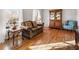 Cozy living room with hardwood floors and large windows at 6784 Tilton Ln, Peachtree Corners, GA 30360