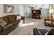 Cozy living room with plush carpet and stairs with open view to kitchen at 6784 Tilton Ln, Peachtree Corners, GA 30360