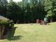 Community playground with swings, slides, and play structures, great for families at 6784 Tilton Ln, Peachtree Corners, GA 30360