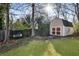 Backyard featuring a large storage shed with a swing seat, adding functionality and charm at 6784 Tilton Ln, Peachtree Corners, GA 30360
