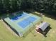 Aerial view of community tennis courts with lights for evening play at 6784 Tilton Ln, Peachtree Corners, GA 30360