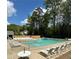 The neighborhood pool is great for relaxing or swimming, with plenty of lounge chairs and sunny skies at 1522 Wood Valley Dr, Marietta, GA 30066