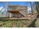 Exterior view of the back of the house with screened porch and deck at 1522 Wood Valley Dr, Marietta, GA 30066