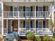 Inviting double porch with white railings and classic blue shutters create a welcoming entrance at 1522 Wood Valley Dr, Marietta, GA 30066