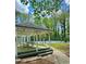 Enjoy the outdoors in the community gazebo, perfect for picnics, overlooking the tennis court and garden at 1522 Wood Valley Dr, Marietta, GA 30066