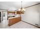 Bright kitchen featuring ample counter space, wooden cabinets, and tile flooring at 1522 Wood Valley Dr, Marietta, GA 30066