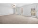 Expansive bedroom with neutral carpet, natural light, and access to the backyard at 1522 Wood Valley Dr, Marietta, GA 30066