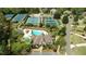 Aerial view of community recreation center featuring pool, tennis courts, clubhouse and parking at 2260 Wood Falls Dr, Cumming, GA 30041