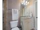 Cozy bathroom with neutral-toned walls, a granite-topped vanity, and decorative lighting at 2260 Wood Falls Dr, Cumming, GA 30041