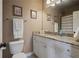 Cozy bathroom featuring granite countertops and a large mirror at 2260 Wood Falls Dr, Cumming, GA 30041