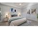 Serene bedroom featuring a plush bed, stylish decor, and light-filled doors to the outside at 2260 Wood Falls Dr, Cumming, GA 30041