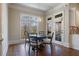 Cozy breakfast nook features hardwood floors, natural light, and backyard views at 2260 Wood Falls Dr, Cumming, GA 30041