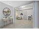 Stylish hallway featuring a console table, shelves, artwork, and doorway access at 2260 Wood Falls Dr, Cumming, GA 30041