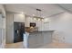 Elegant kitchen showcasing a center island, custom cabinets, and modern stainless steel appliances at 2260 Wood Falls Dr, Cumming, GA 30041