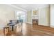 Spacious living room features hardwood floors, fireplace, piano, and archway at 2260 Wood Falls Dr, Cumming, GA 30041