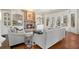 Cozy living room features a stone fireplace, built-in shelving and a bay window at 2260 Wood Falls Dr, Cumming, GA 30041
