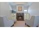 Inviting living room area featuring a stone fireplace, built-in shelving, and comfortable seating at 2260 Wood Falls Dr, Cumming, GA 30041