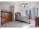 Comfortable main bedroom with tray ceilings and large windows creating a tranquil space at 2260 Wood Falls Dr, Cumming, GA 30041
