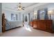 Spacious main bedroom featuring tray ceilings, large windows, and an ensuite bathroom at 2260 Wood Falls Dr, Cumming, GA 30041