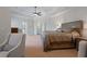 Spacious main bedroom featuring trey ceilings, panel molding, and a large window at 2260 Wood Falls Dr, Cumming, GA 30041