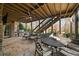 Outdoor patio with lounge chairs, barbecue, stairs to yard, and ceiling fan at 2260 Wood Falls Dr, Cumming, GA 30041