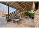 This covered patio features ceiling fan, lounge furniture, and stairs to the yard at 2260 Wood Falls Dr, Cumming, GA 30041
