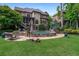 Gorgeous backyard with a stone-surrounded pool, umbrella, and outdoor seating on the well-manicured lawn at 2260 Wood Falls Dr, Cumming, GA 30041