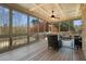 Relaxing screened porch with wooded views, perfect for outdoor living and entertaining at 2260 Wood Falls Dr, Cumming, GA 30041