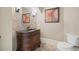 Charming powder room with custom vanity, granite countertop, and decorative mirror at 2260 Wood Falls Dr, Cumming, GA 30041