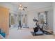 A well-equipped exercise room with workout machines and ample natural light at 2260 Wood Falls Dr, Cumming, GA 30041
