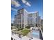 Stunning aerial view of the condo community with a pool, tennis court, and beautifully landscaped green space at 2425 Peachtree Ne Rd # 604, Atlanta, GA 30305