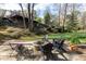 Backyard featuring a stone patio with fire pit and outdoor seating at 3605 Wood Valley Ne Ct, Brookhaven, GA 30319