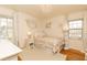 Charming bedroom features natural light, chandelier, and hardwood flooring at 3605 Wood Valley Ne Ct, Brookhaven, GA 30319