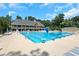 Large community pool with multiple lanes and diving blocks, surrounded by lounge chairs at 3605 Wood Valley Ne Ct, Brookhaven, GA 30319