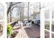 Charming deck with seating, grill, and view provides the perfect space for outdoor gatherings and relaxation at 3605 Wood Valley Ne Ct, Brookhaven, GA 30319