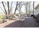 Inviting deck with grill and chairs, perfect for outdoor entertaining and enjoying the surrounding greenery at 3605 Wood Valley Ne Ct, Brookhaven, GA 30319