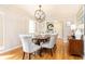 Elegant dining room featuring hardwood floors, chandelier, and seating for six at 3605 Wood Valley Ne Ct, Brookhaven, GA 30319