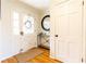 Bright entryway with hardwood floors and a decorative wreath on the front door at 3605 Wood Valley Ne Ct, Brookhaven, GA 30319