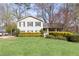 Charming two-story home featuring a well-manicured lawn and neatly trimmed hedges at 3605 Wood Valley Ne Ct, Brookhaven, GA 30319