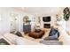 Cozy living room with a brick fireplace, built-in shelving, and plush seating at 3605 Wood Valley Ne Ct, Brookhaven, GA 30319